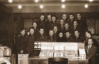 Computer STRELA; control panel. Major V.P. Isaev (the author) is the first on the right.